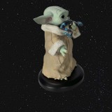 Figurine Star Wars - Grogu eating the Frog - The Mandalorian